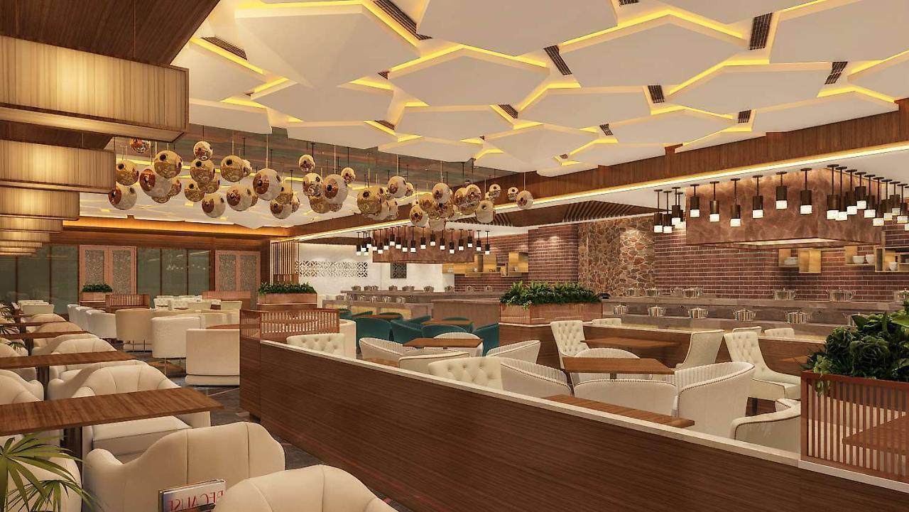 فندق Radisson Blu Towers Kaushambi Delhi Ncr غازي أباد المظهر الخارجي الصورة Interior of a restaurant