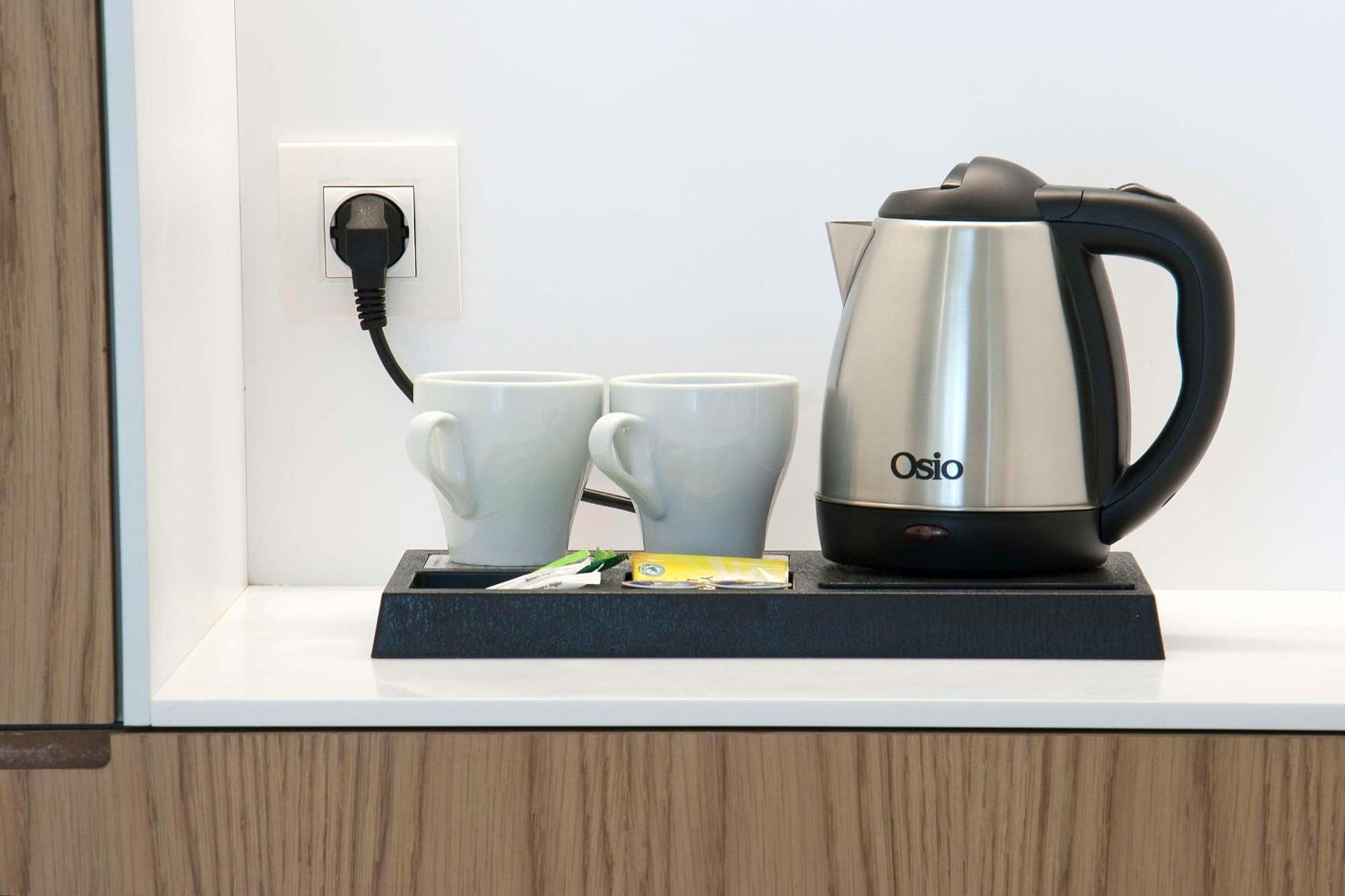 فندق Radisson Blu Towers Kaushambi Delhi Ncr غازي أباد المظهر الخارجي الصورة A kettle